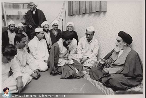 Imam and a Pakistani group