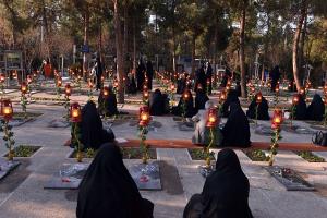 Cleaning and decorating the shrines of martyrs at Behest-e-Zahra cemetery 