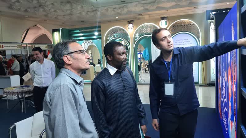 Foreign guests visit the International Affairs Office booth at the 36th Tehran International Book Fair